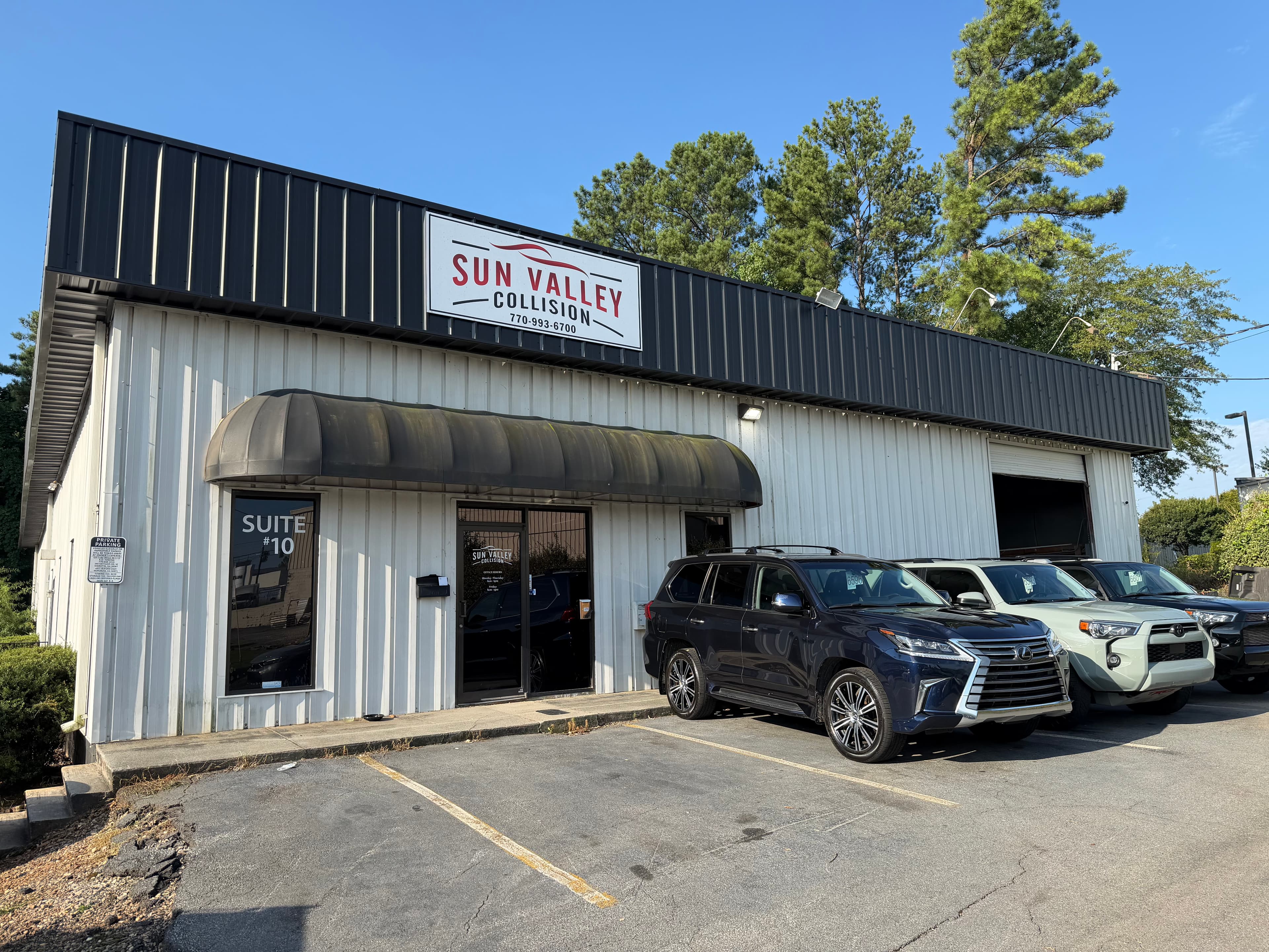 Sun Valley Collision shop front and signage in Roswell, GA